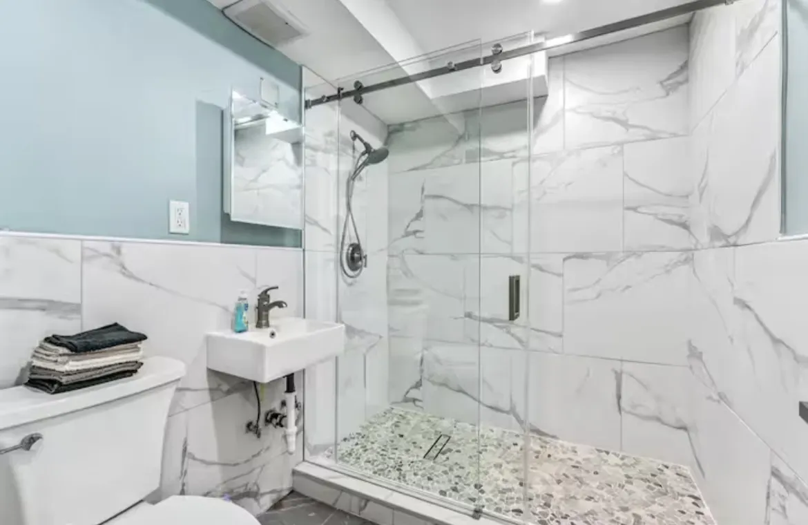 Professional bathroom tile installation and grouting completed by GC Trusted Builders LLC general contractor in Melbourne Florida featuring custom ceramic tile work